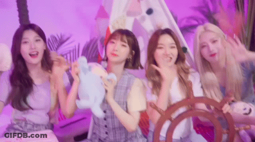A Group Of Young Women Are Standing Next To Each Other In A Room With A Tent . GIF