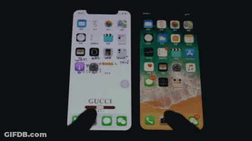 A Gucci Phone Is Next To An Iphone GIF