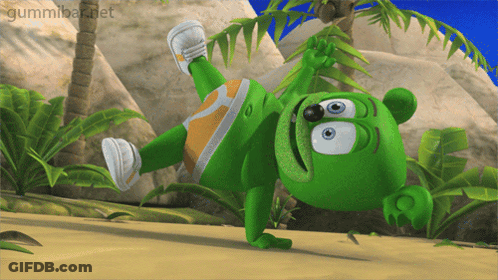 A Gummy Bear Is Doing A Handstand On A Beach GIF
