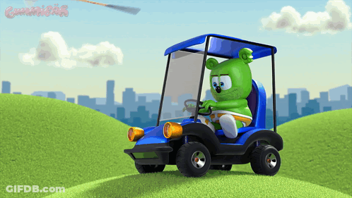 A Gummy Bear Is Driving A Blue Golf Cart On A Hill GIF