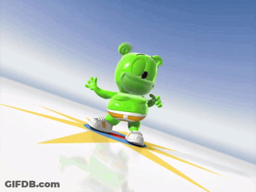 A Gummy Bear Is Riding A Snowboard Down A Hill GIF