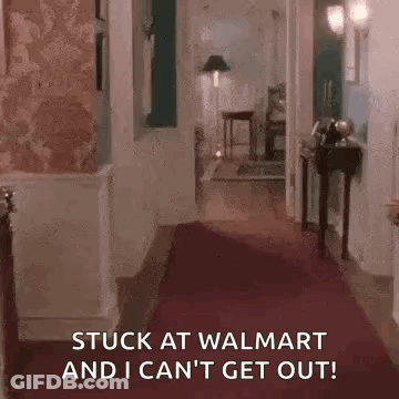 A Hallway With A Red Carpet And The Words `` Stuck At Walmart And I Can 'T Get Out '' GIF