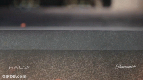 A Halo Advertisement With A Hand Sticking Out Of The Wall GIF