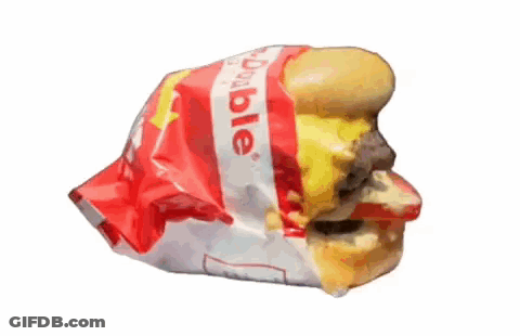A Hamburger Is Wrapped In A Plastic Bag That Says Dole GIF