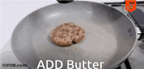 A Hamburger Patty Is Being Cooked In A Frying Pan With The Words " Add Butter " Below It GIF