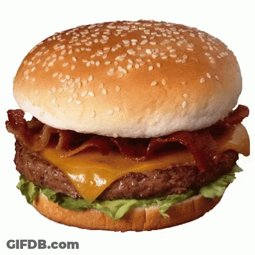 A Hamburger With Cheese Bacon And Lettuce On A Bun With Sesame Seeds GIF