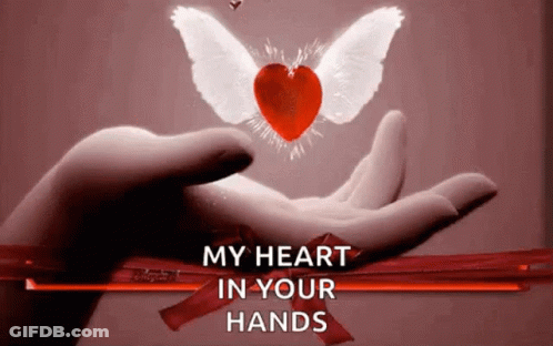 A Hand Holding A Heart With Wings And The Words " My Heart In Your Hands " Below It GIF