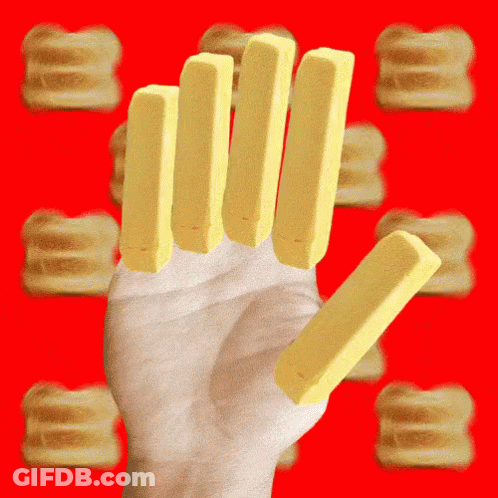 A Hand Holding A Stack Of Butter Sticks GIF