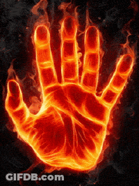 A Hand Is Covered In Flames And Looks Like It 'S On Fire GIF