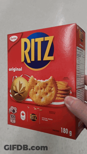A Hand Is Holding A Box Of Ritz Original Crackers GIF