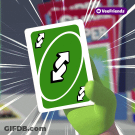 A Hand Is Holding A Green Uno Card With Arrows On It GIF