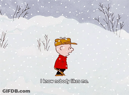 A Hand Is Holding A Piece Of Paper That Says " I Like You Charlie Brown Signed Kimba " GIF