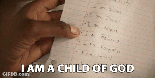 A Hand Is Holding A Piece Of Paper With The Words I Am A Child Of God On It GIF