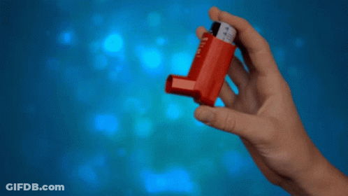 A Hand Is Holding A Red Inhaler With The Number 4 On It GIF
