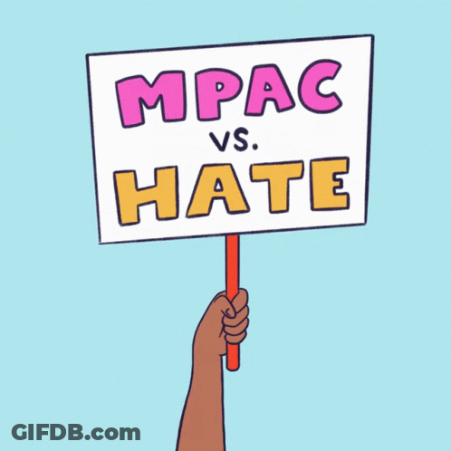 A Hand Is Holding A Sign That Says Mpac Vs. Hate GIF