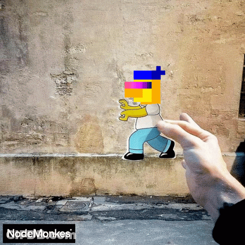 A Hand Is Holding A Sticker Of Homer Simpson In Front Of A Nodemonkes Logo GIF