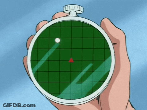 A Hand Is Holding A Watch That Shows A Red Triangle On The Screen GIF