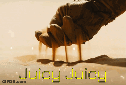 A Hand Is Holding Sand And The Words Juicy Juicy Are Written Below It GIF