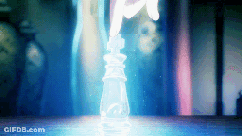 A Hand Is Reaching For A Chess Piece That Is Glowing In The Dark GIF