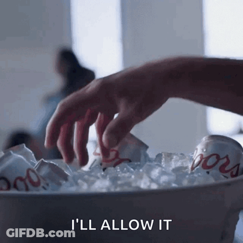 A Hand Is Reaching Into A Bucket Of Ice With A Can Of Coors In It GIF