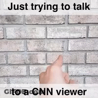 A Hand Pointing At A Brick Wall With The Words Just Trying To Talk To A Cnn Viewer GIF