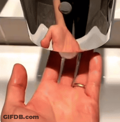 A Hand With A Ring Is Being Washed In A Bathroom Sink GIF