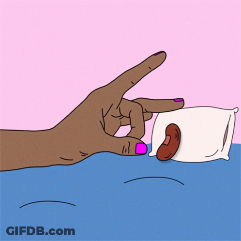 A Hand With Pink Nails Is Reaching For A Pillow With A Sausage On It GIF