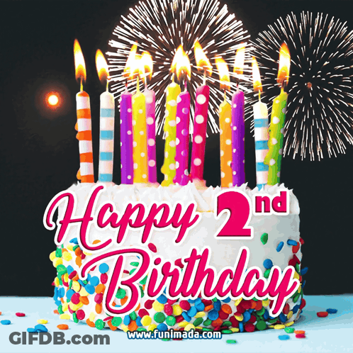 A Happy 2Nd Birthday Cake With Candles And Fireworks GIF