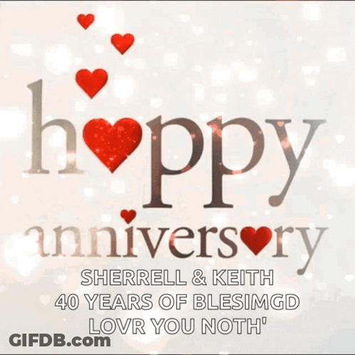 A Happy Anniversary Greeting Card With Red Hearts GIF