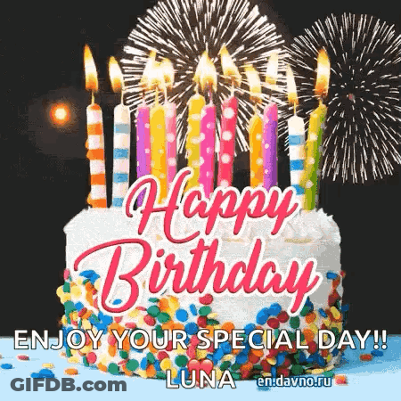 A Happy Birthday Cake With Candles And Fireworks In The Background GIF