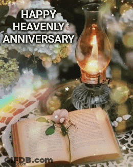 A Happy Heavenly Anniversary Greeting Card With A Book And A Candle GIF