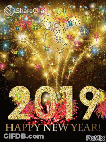 A Happy New Year Greeting Card With Fireworks Behind The Numbers 2019 GIF