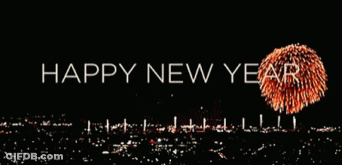 A Happy New Year Greeting With Fireworks Displayed In The Background GIF