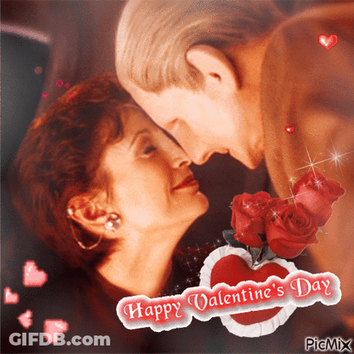 A Happy Valentine 'S Day Greeting Card With A Couple Kissing GIF