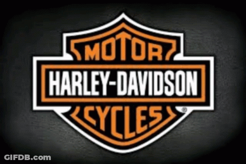 A Harley Davidson Logo Is On A Dark Background GIF