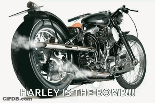A Harley Davidson Motorcycle With Smoke Coming Out Of The Tail GIF