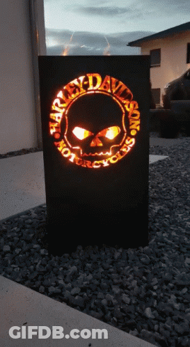A Harley Davidson Motorcycles Sign Is Lit Up GIF