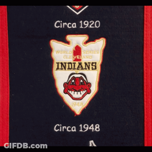A Hat Hanging On A Door With A Cleveland Indians Banner GIF