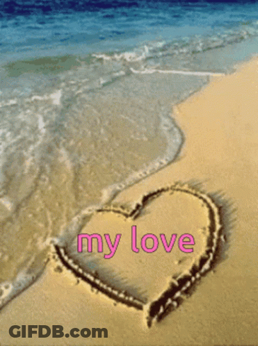 A Heart Drawn In The Sand With The Words " My Love " Written In Pink GIF