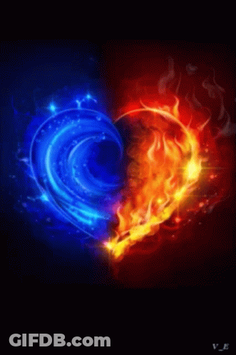 A Heart Made Of Blue And Red Flames On A Black Background . GIF