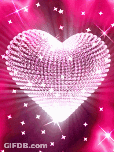 A Heart Made Of Rhinestones Is Surrounded By Pink Stars GIF