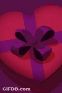 A Heart Shaped Box Of Chocolates With I Love You Written On Them GIF