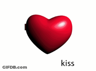 A Heart Shaped Mirror With A Picture Of A Man On It And The Word Kiss Below It GIF