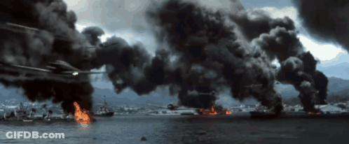A Helicopter Is Flying Over A Body Of Water With Smoke Coming Out Of It GIF