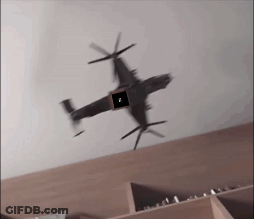 A Helicopter Is Flying Over A Shelf With A Square In The Middle That Says I. GIF