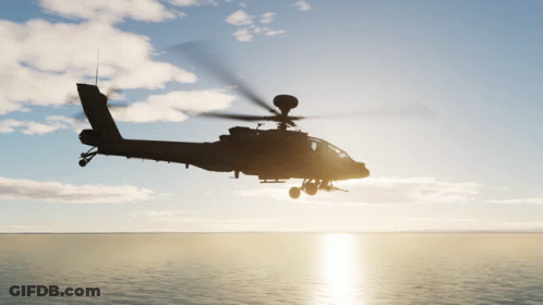 A Helicopter Is Flying Over The Ocean With The Sun Shining Through The Clouds GIF