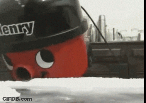 A Henry Vacuum Cleaner Is Sitting On A Kitchen Counter GIF