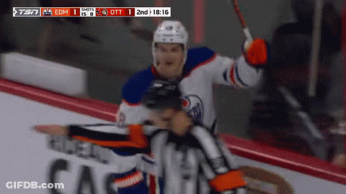 A Hockey Game Between Edmonton Oilers And Calgary Canucks GIF