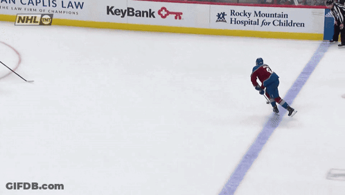 A Hockey Game Is Being Played And The Goalie Is Wearing The Number 27 GIF