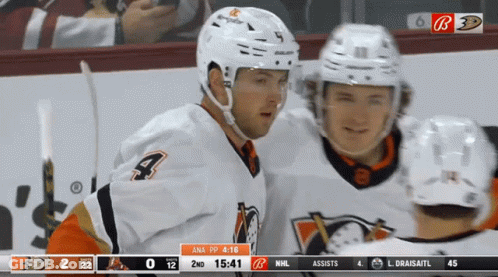 A Hockey Game Is Being Played And The Score Is 2 To 12 GIF